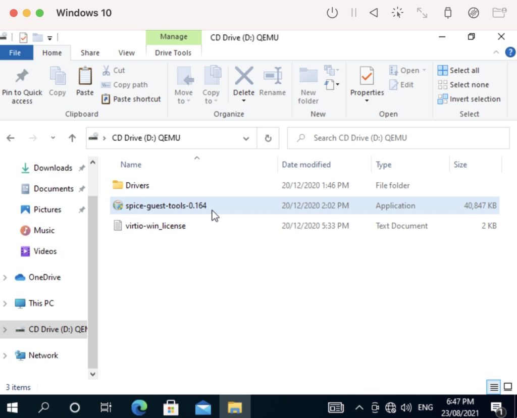 Screenshot of File Explorer with the Spice Guest Tools .exe file highlighted.